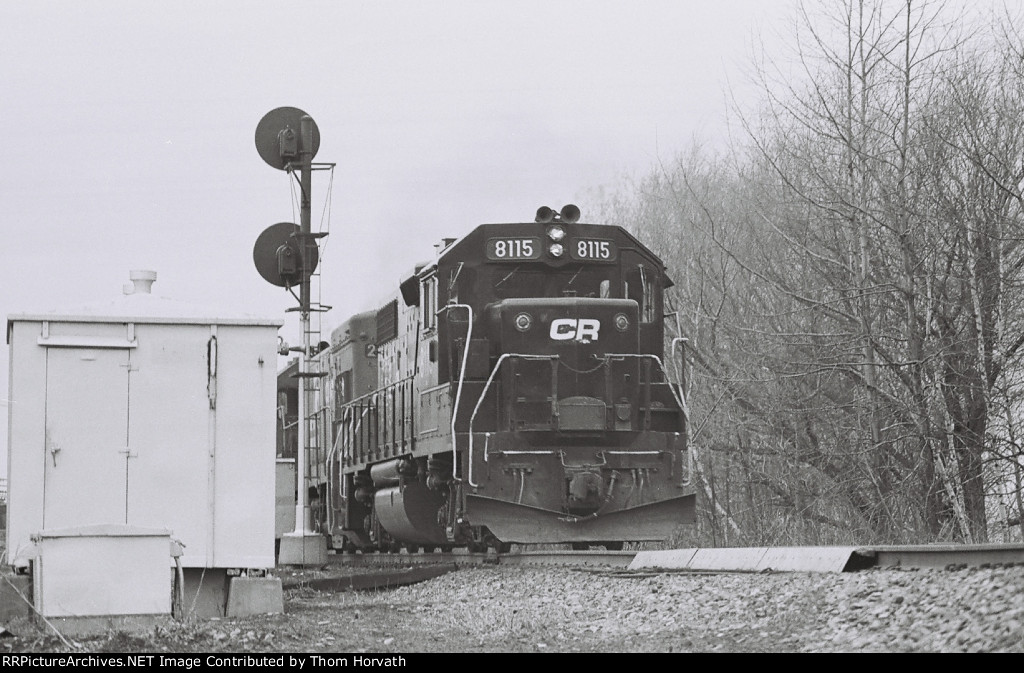CR 8115 leads a mixed freight east past CP WEST PORTAL at MP 66